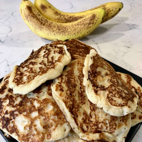 A close up image of banana pancakes that were created using this recipe