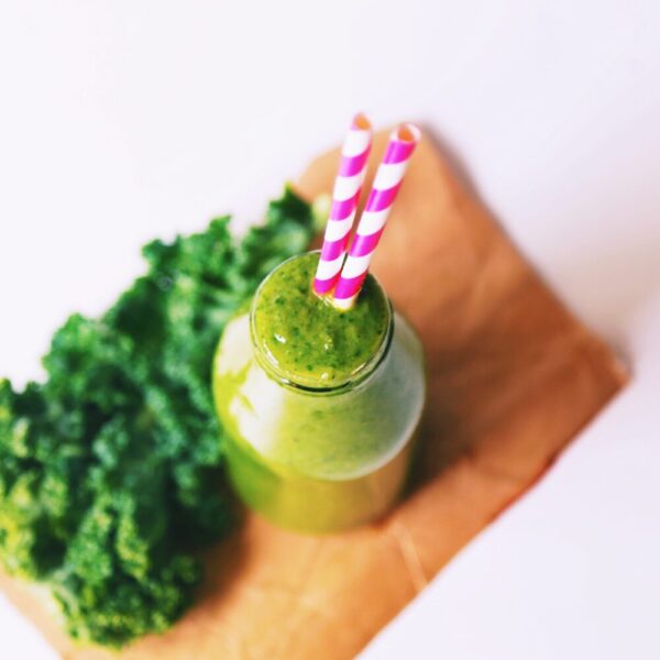 green smoothie with fun straw