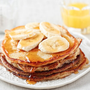 A close up image of banana pancakes that were created using this recipe